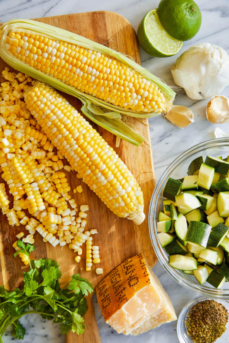 Parmesan Zucchini and Corn - A healthy 10 minute zucchini side dish to dress up any meal. It's so simple yet full of flavor! SO SO GOOD.
