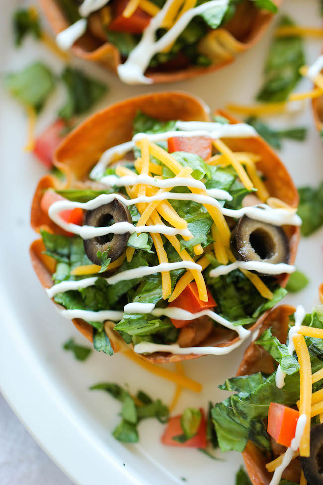 Mini Taco Salad Cups - These cute salad bowls are so fun to make, and even more fun to gobble up! Perfect as an appetizer or easy dinner!