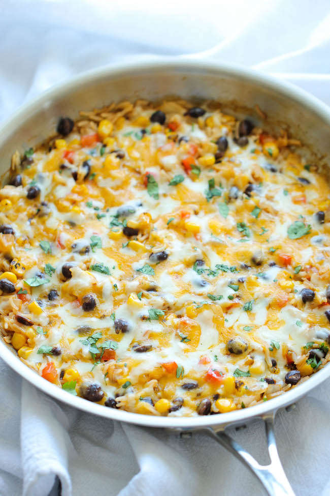 Cheesy Enchilada Rice Skillet - The easiest enchilada you will ever make. No rolling, no folding. Just throw everything into a skillet and you're set!