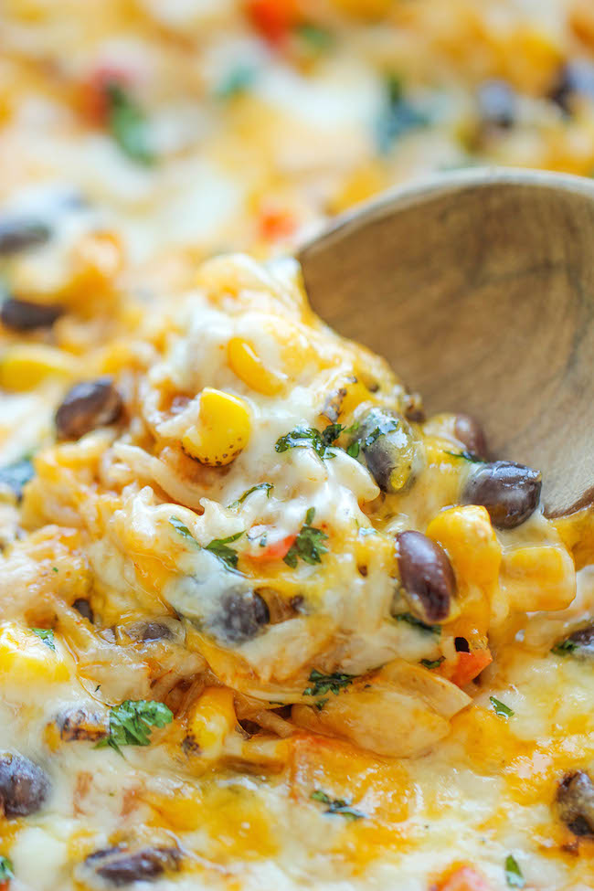 Cheesy Enchilada Rice Skillet - The easiest enchilada you will ever make. No rolling, no folding. Just throw everything into a skillet and you're set!