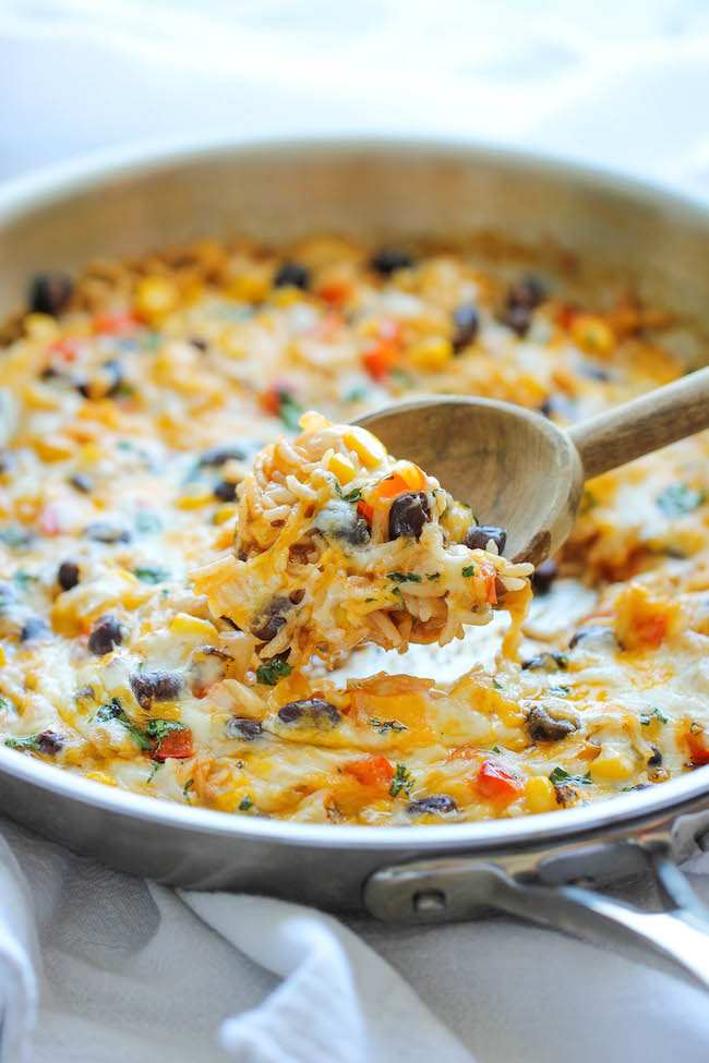 Cheesy Enchilada Rice Skillet - The easiest enchilada you will ever make. No rolling, no folding. Just throw everything into a skillet and you're set!