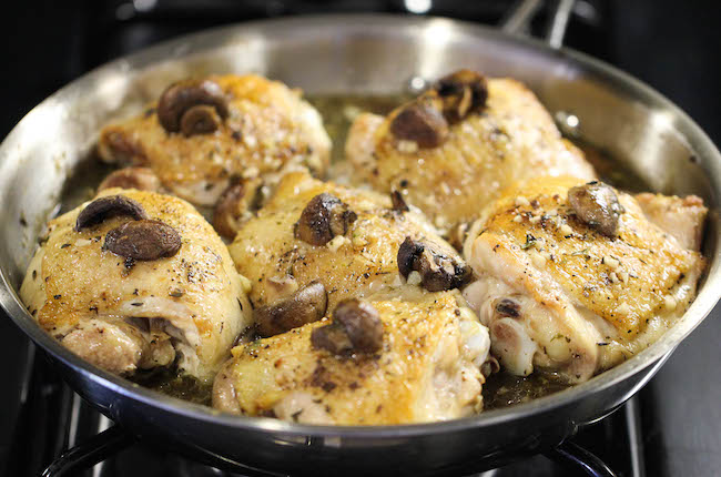 Baked Chicken and Mushroom Skillet - The most flavorful chicken topped with the creamiest mushroom sauce. An easy meal for those busy weeknights!