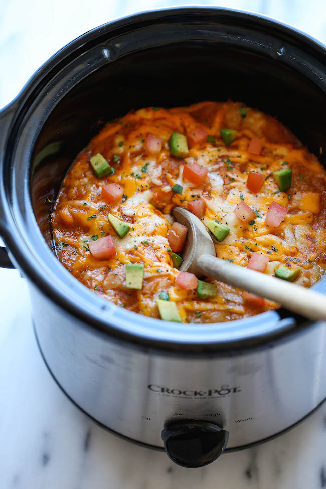 Slow Cooker Enchilada Stack - Simply turn on your crockpot and forget all about it until you have the cheesiest and creamiest enchiladas ever! It's so easy!