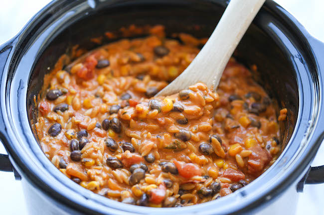 Slow Cooker Enchilada Orzo - The easiest, creamiest enchilada pasta ever. Even the pasta gets cooked right in the crockpot!