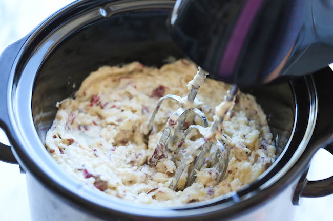 Slow Cooker Garlic Mashed Potatoes - The easiest mashed potatoes you will ever make. Just throw it all in the crockpot and you're set. Easy peasy!