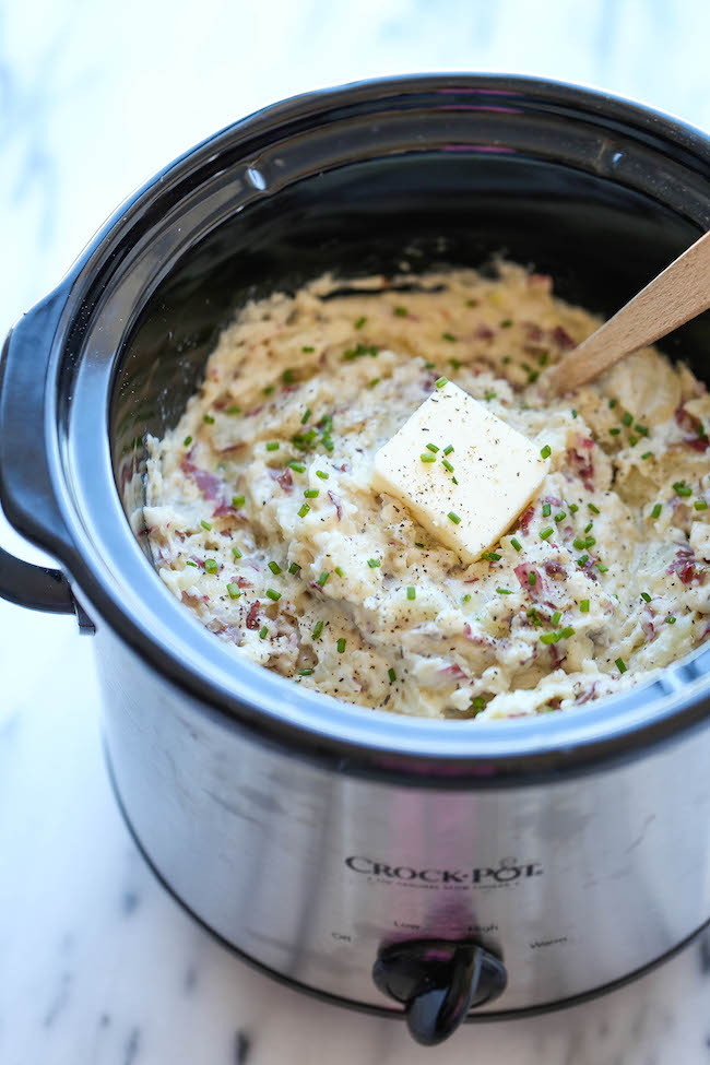 Slow Cooker Garlic Mashed Potatoes - The easiest mashed potatoes you will ever make. Just throw it all in the crockpot and you're set. Easy peasy!