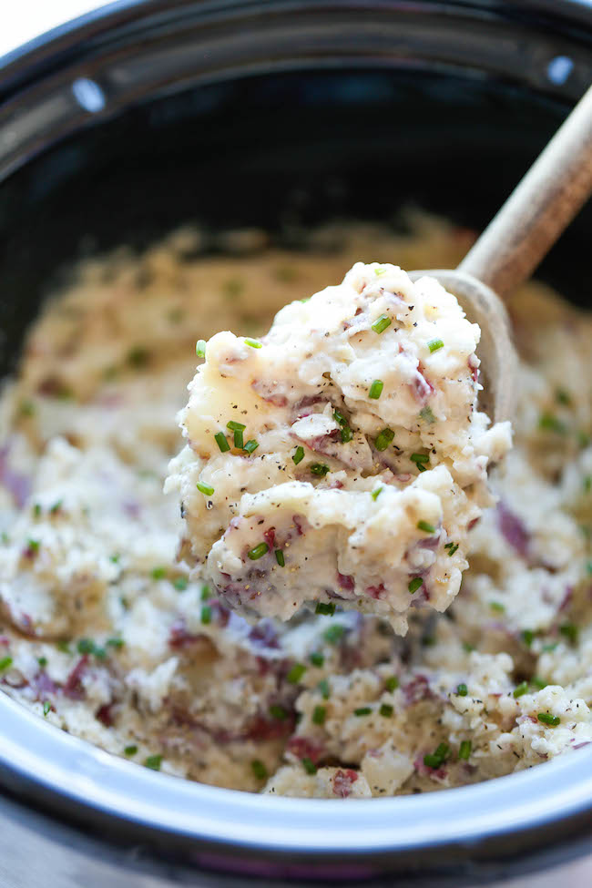 Slow Cooker Garlic Mashed Potatoes - The easiest mashed potatoes you will ever make. Just throw it all in the crockpot and you're set. Easy peasy!