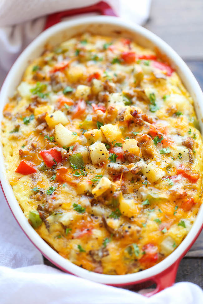 Cheesy Breakfast Casserole - The best and easiest make-ahead breakfast casserole loaded with sausage, potatoes and cheesy goodness!