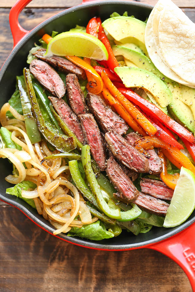 Steak Fajita Salad - All the amazing flavors of a fajita conveniently in a hearty salad, served with the creamiest cilantro lime dressing!