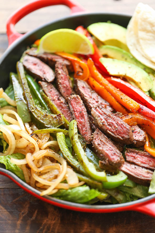 Steak Fajita Salad - All the amazing flavors of a fajita conveniently in a hearty salad, served with the creamiest cilantro lime dressing!