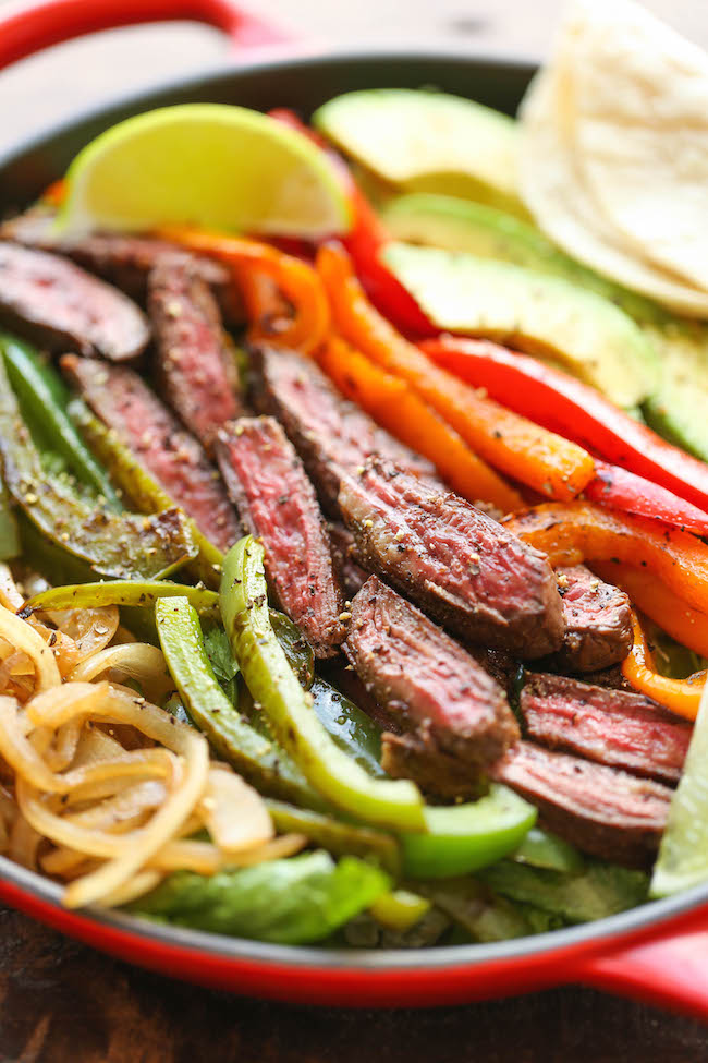 Steak Fajita Salad - All the amazing flavors of a fajita conveniently in a hearty salad, served with the creamiest cilantro lime dressing!