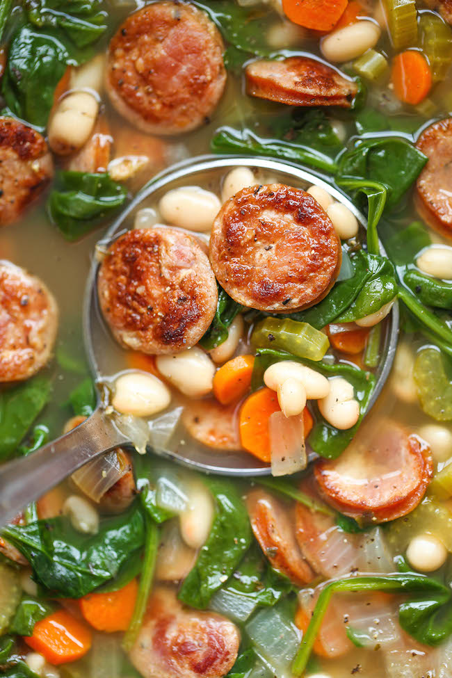 Slow Cooker Sausage, Spinach and White Bean Soup - So hearty, so comforting, and so easy to make right in the crock-pot with just 10 min prep. Easy peasy!