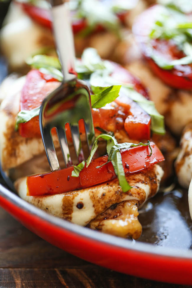Baked Caprese Chicken - Amazingly crisp-tender chicken baked with melted mozzarella and topped with juicy tomatoes, fresh basil and balsamic reduction!