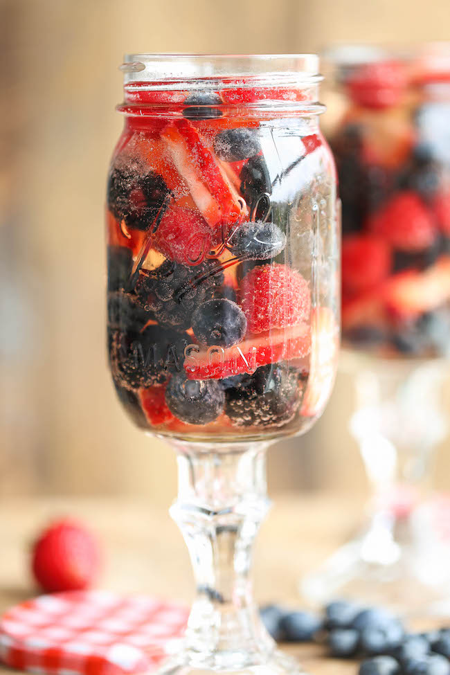 Easy Berry Sangria - So easy and refreshing, chockfull of strawberries, raspberries, blackberries and blueberries. And all you need is just 5 min prep!