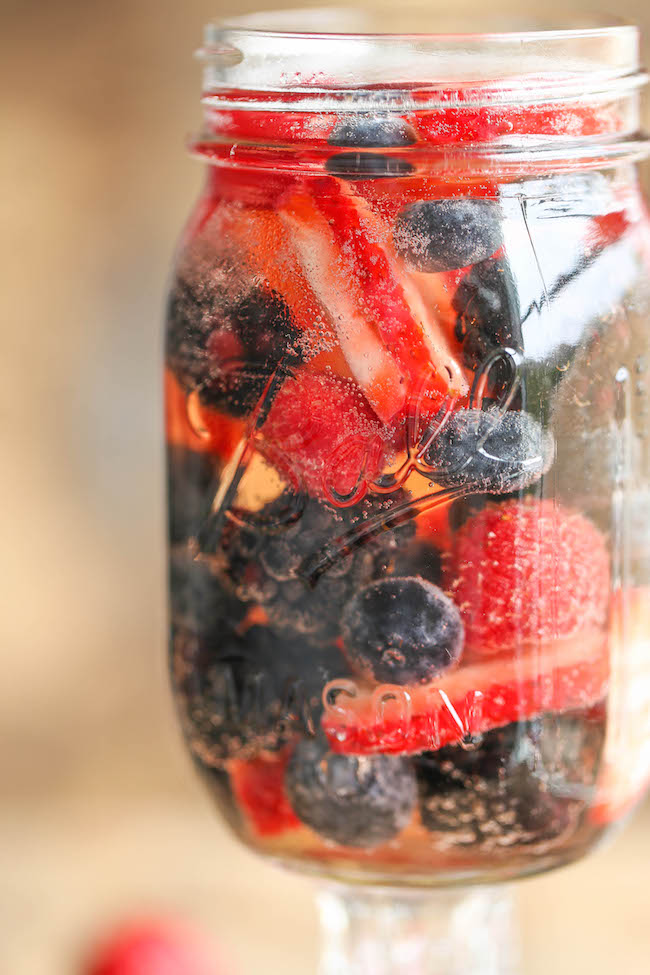 Easy Berry Sangria - So easy and refreshing, chockfull of strawberries, raspberries, blackberries and blueberries. And all you need is just 5 min prep!
