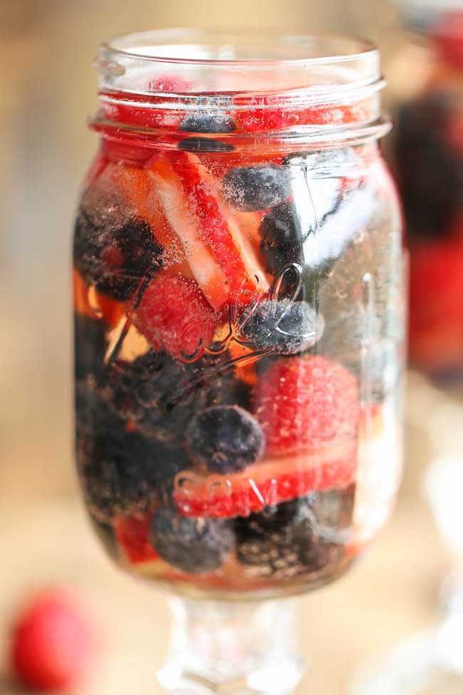 Easy Berry Sangria - So easy and refreshing, chockfull of strawberries, raspberries, blackberries and blueberries. And all you need is just 5 min prep!