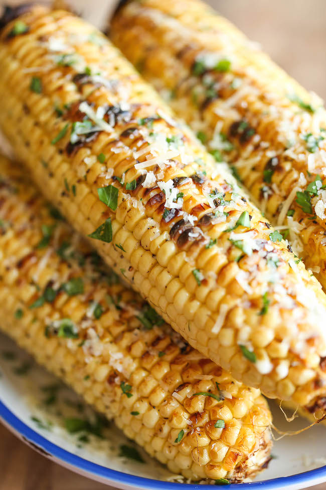 Parmesan Corn on the Cob - So buttery, garlicky and loaded with Parmesan cheese goodness - grilled (or roasted) to absolute perfection! 