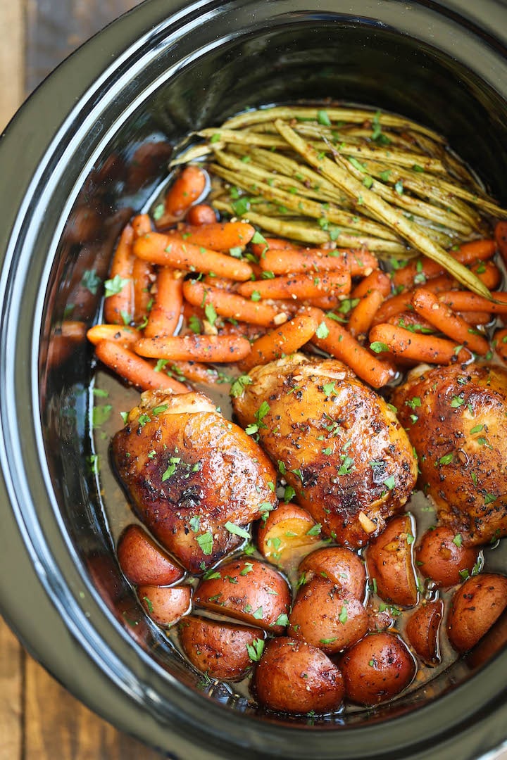 Slow Cooker Honey Garlic Chicken and Veggies - The easiest one pot recipe ever. Simply throw everything in and that's it! No cooking, no sauteeing. SO EASY!