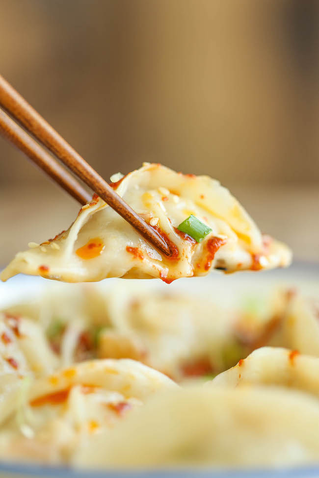 Spicy Chicken Potstickers - Make-ahead, freezer-friendly dumplings made completely from scratch with an optional hot chili oil sauce for a kick of heat!
