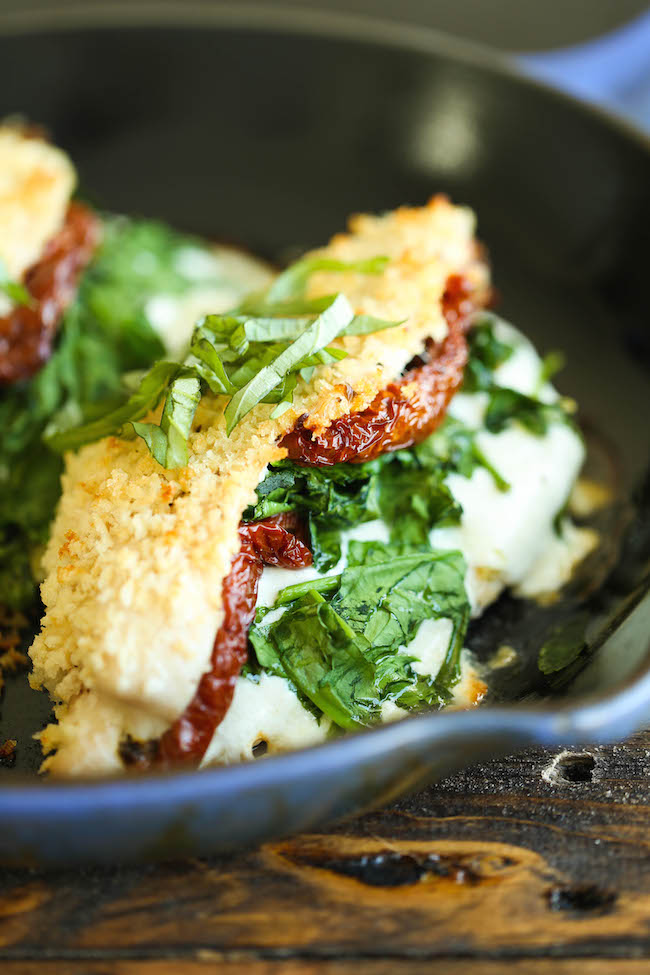 Mozzarella Stuffed Chicken - Chicken breasts stuffed with mozzarella, spinach, and sun dried tomatoes - baked to absolute crisp-tender cheesy perfection!