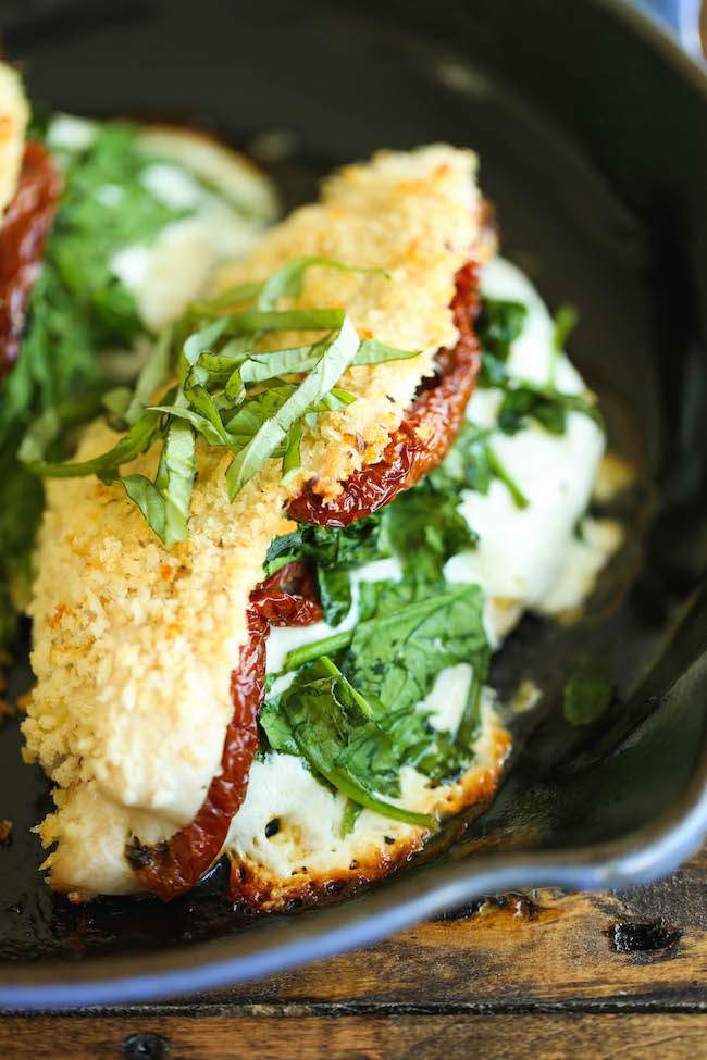 Mozzarella Stuffed Chicken - Chicken breasts stuffed with mozzarella, spinach, and sun dried tomatoes - baked to absolute crisp-tender cheesy perfection!