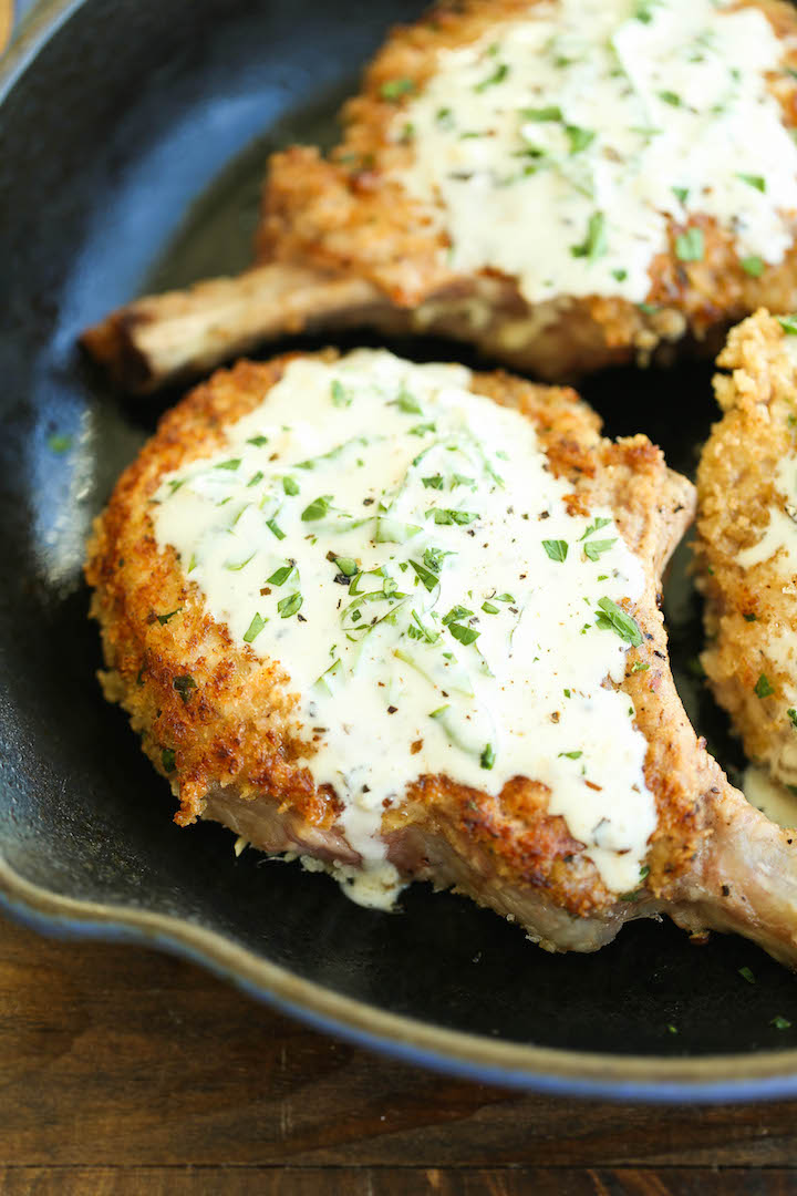 Pork Chops with Lemon Basil Cream Sauce - Juicy crisp-tender pork chops served with the most heavenly cream sauce. Made in 30 min. You can't beat that!