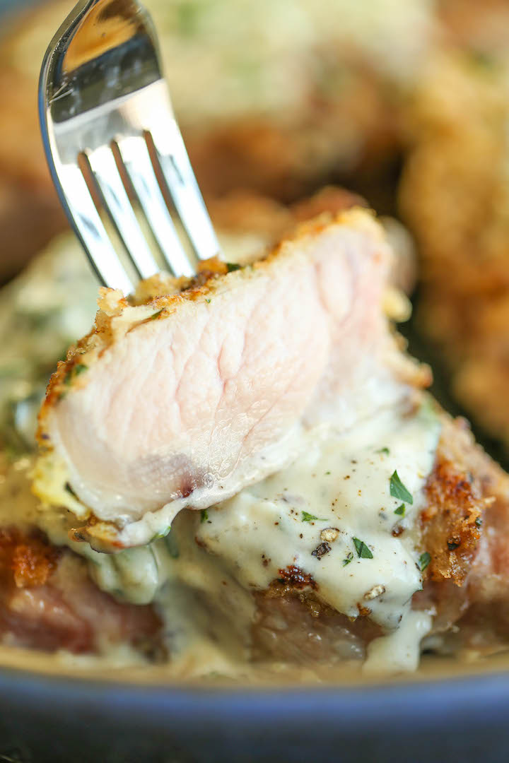 Pork Chops with Lemon Basil Cream Sauce - Juicy crisp-tender pork chops served with the most heavenly cream sauce. Made in 30 min. You can't beat that!