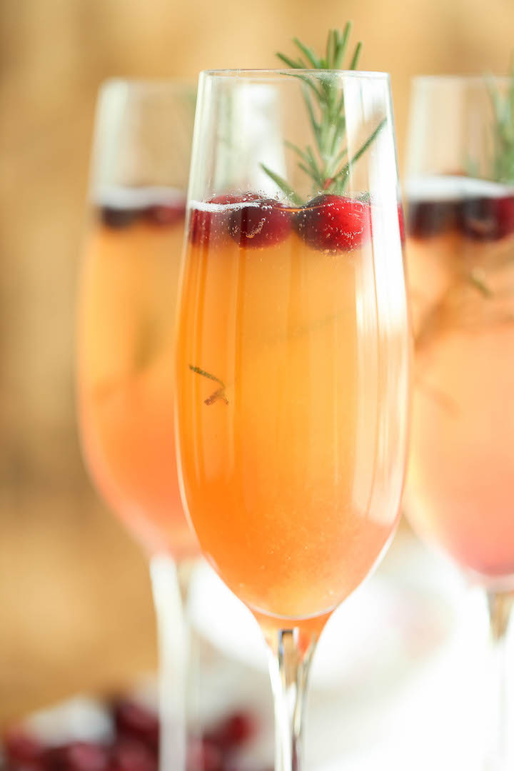 Cranberry Mimosa - The only holiday cocktail recipe you need. Just 6 ingredients (2 are garnishes) for the prettiest, easiest and elegant drink ever! Done.