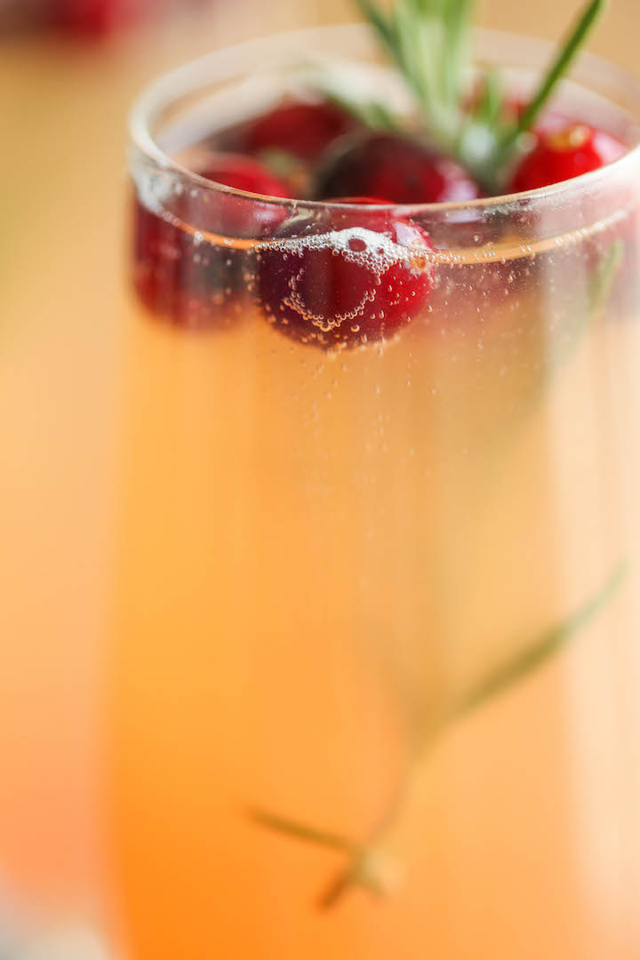 Cranberry Mimosa - The only holiday cocktail recipe you need. Just 6 ingredients (2 are garnishes) for the prettiest, easiest and elegant drink ever! Done.