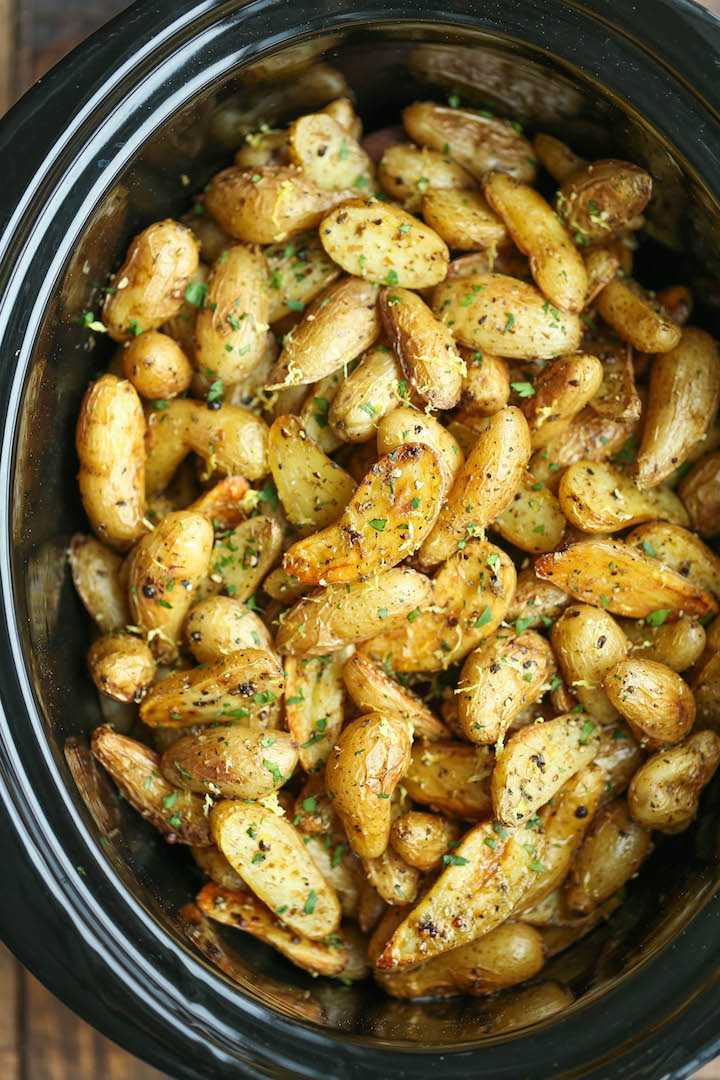 Slow Cooker Greek Potatoes - Buttery crisp-tender potatoes with olive oil, garlic, lemon and oregano. Made so easily in the crockpot - less than 5 min prep!