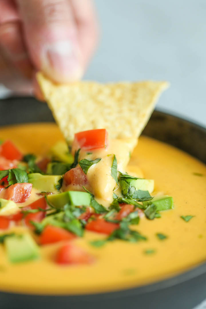 10 Minute Nacho Cheese - Super easy and completely made from scratch (no Velveeta)! It’s cheesy, sharp, smoky, unbelievably velvety and just SO GOOD!