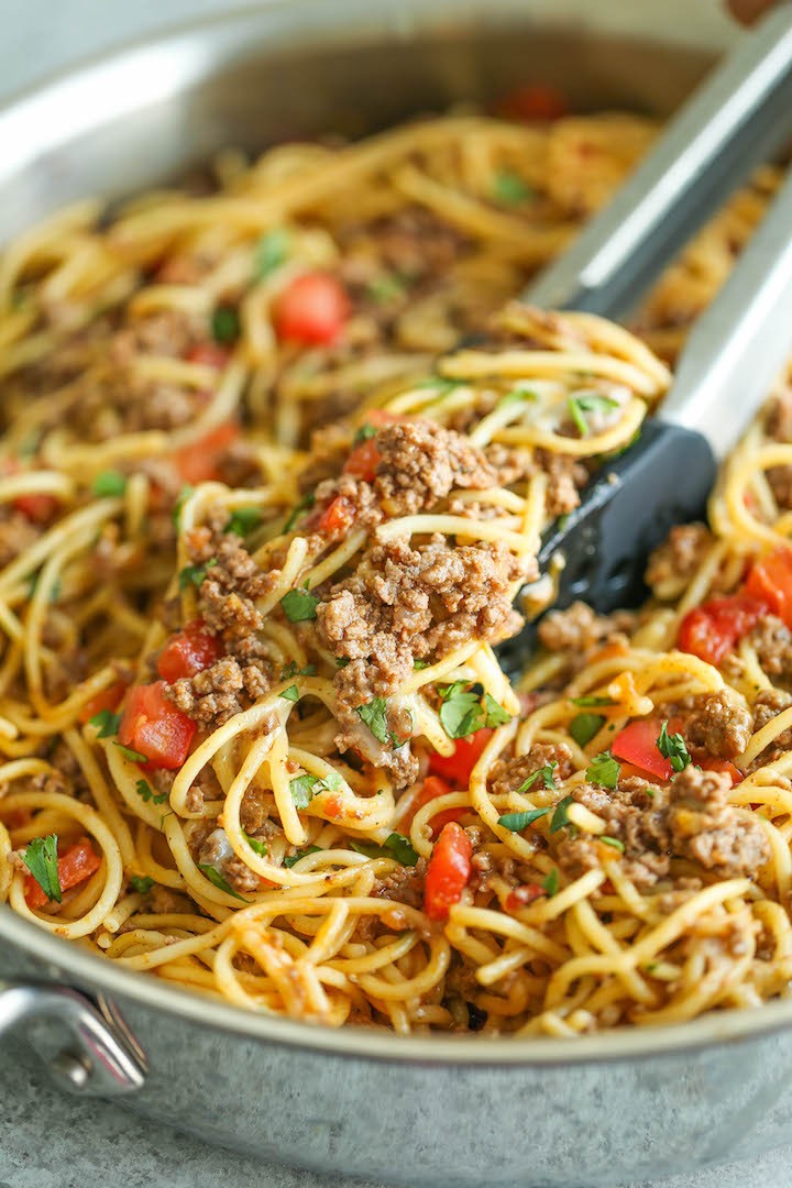 One Pot Taco Spaghetti - All your favorite flavors of tacos in spaghetti form - made in ONE PAN!  So cheesy, comforting and stinking easy with no clean-up!