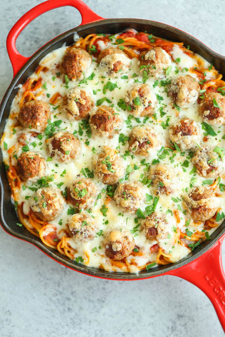 Baked Spaghetti and Meatballs - Traditional spaghetti and meatballs is turned into the most amazing baked cheesy casserole ever! A family favorite for sure!