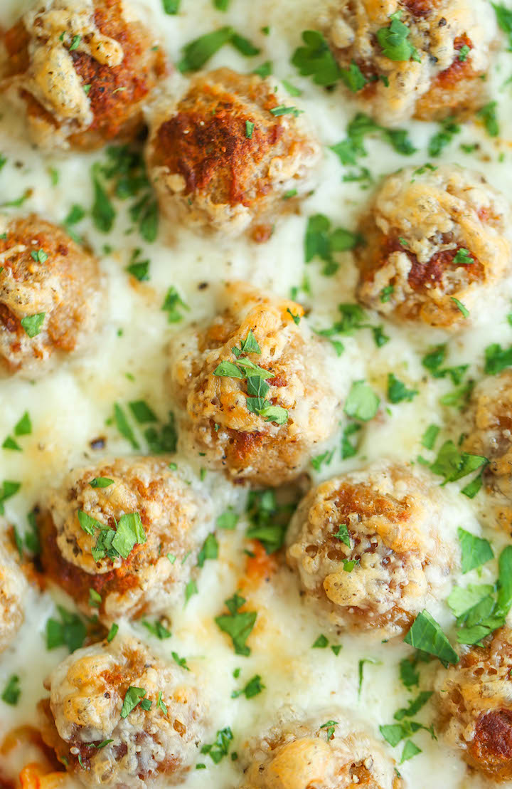 Baked Spaghetti and Meatballs - Traditional spaghetti and meatballs is turned into the most amazing baked cheesy casserole ever! A family favorite for sure!