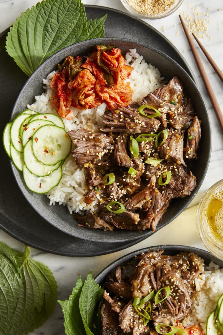Slow Cooker Asian Short Ribs - Literally fall-off-the-bone tender! SO SO GOOD. Set and forget right in your crockpot. So easy with zero fuss!