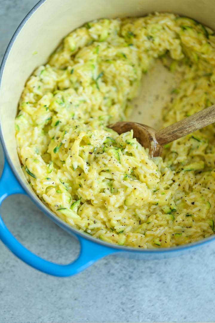 Cheesy Garlic Zucchini Rice - Made in ONE POT! So easy. So cheesy. So garlicky. A side dish for all of your meals! Can be made with brown rice or quinoa.