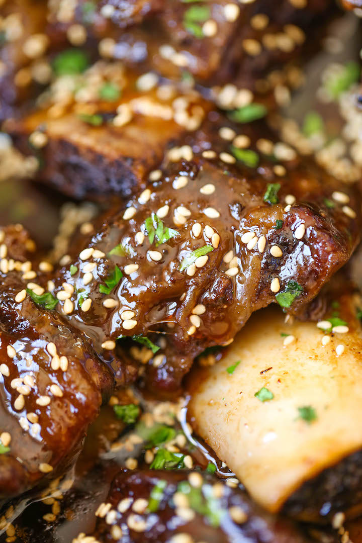 Slow Cooker Asian Short Ribs - Literally fall-off-the-bone tender! And all you have to do is throw everything into a crockpot.That's it! No cooking at all!