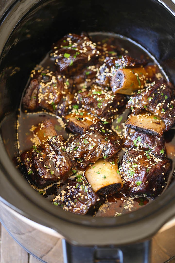 Slow Cooker Asian Short Ribs - Literally fall-off-the-bone tender! And all you have to do is throw everything into a crockpot.That's it! No cooking at all!
