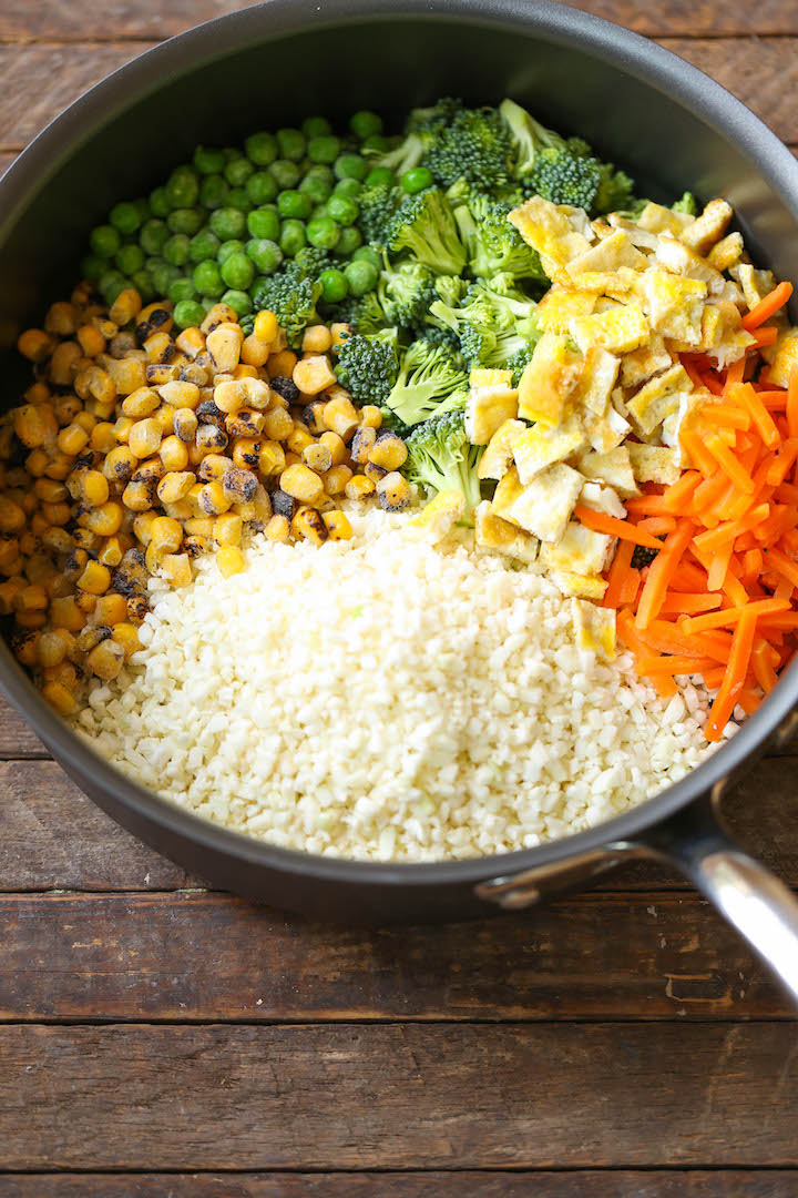 10 Minute Healthy Cauliflower Rice - An amazingly healthy twist on takeout fried rice but you can't even tell the difference. So EASY to make too!