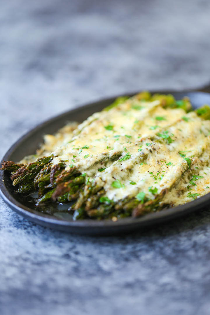 Cheesy Asparagus Gratin - A 5-min appetizer (or side dish)! Simply roast your asparagus with desired herbs, top with cheese and bake until cheesy goodness!