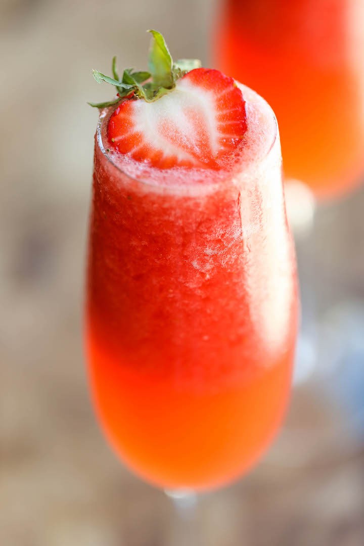 Strawberry Lemonade Bellini - This is a fun twist to your traditional peach bellini, made into a boozy-type slushy using only 4 ingredients with 5 min prep!