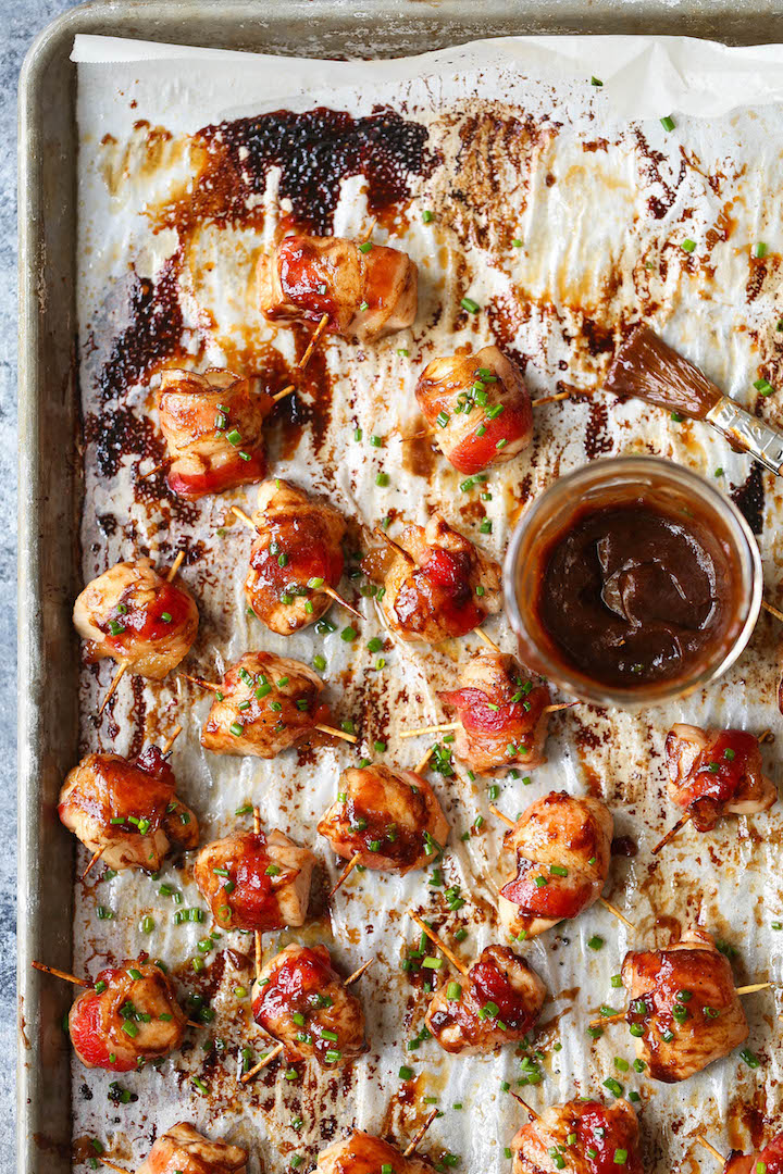 BBQ Chicken Bites - The best crowd-pleasing chicken bites wrapped in crisp-tender bacon and smothered in a smoky-sweet BBQ sauce!