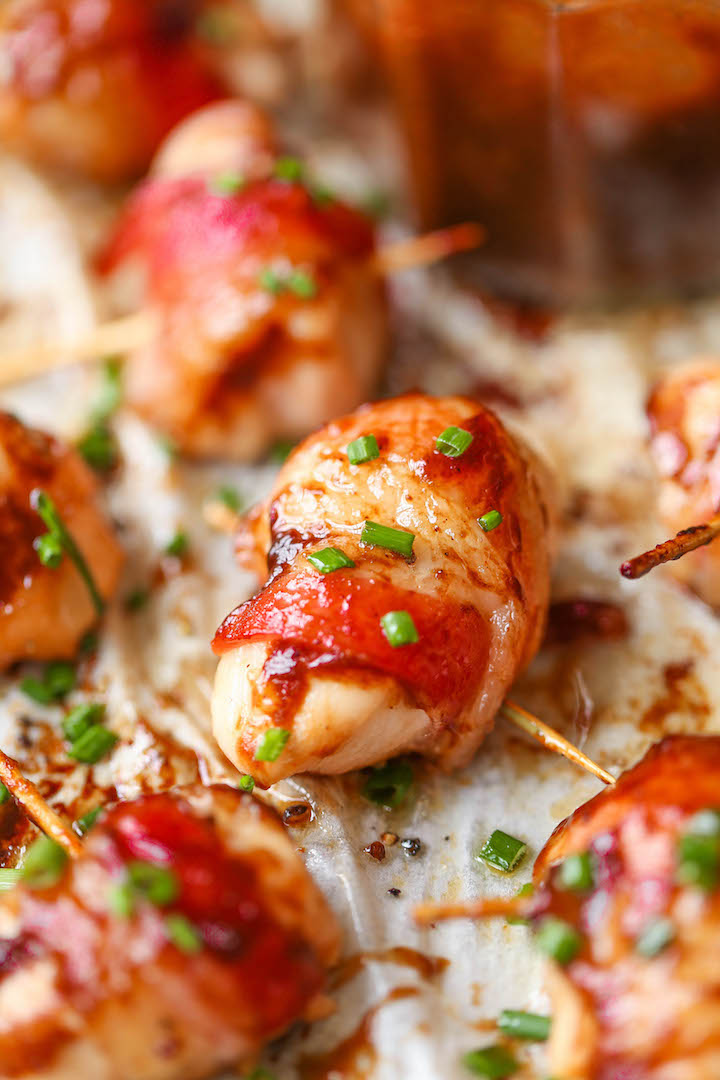 BBQ Chicken Bites - The best crowd-pleasing chicken bites wrapped in crisp-tender bacon and smothered in a smoky-sweet BBQ sauce!