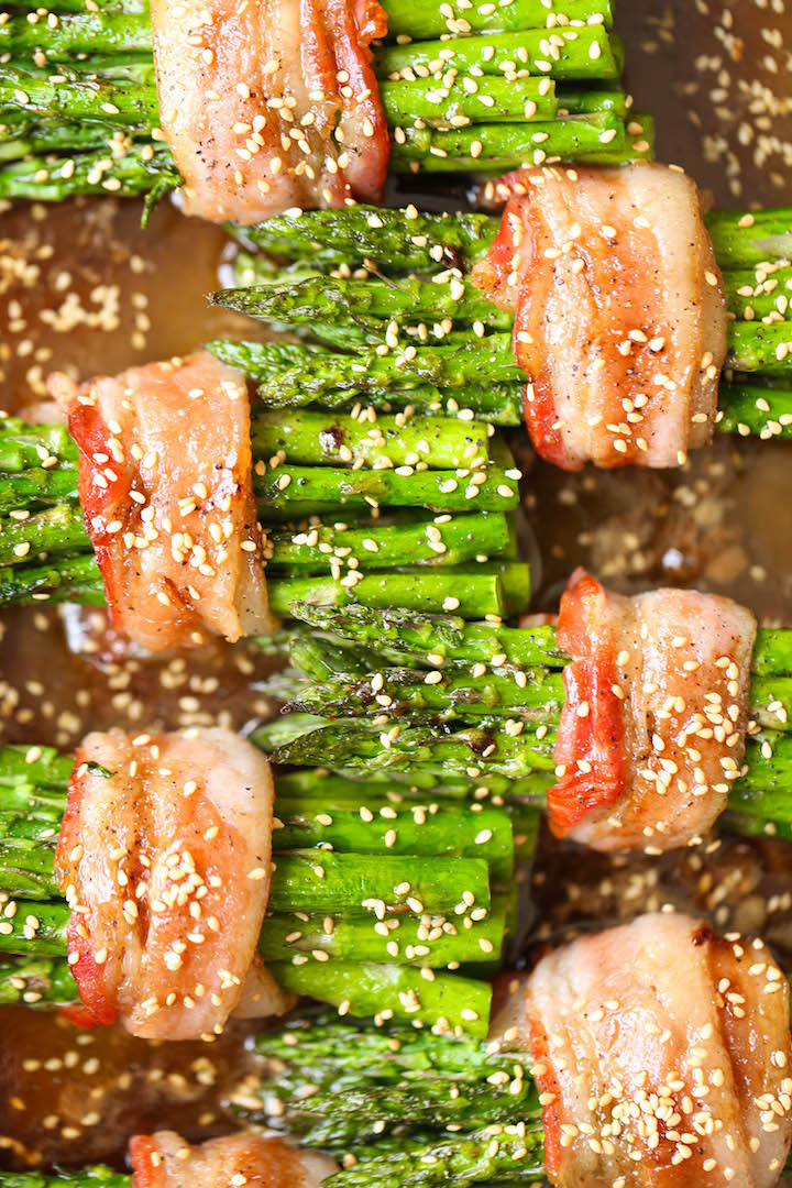 Bacon Wrapped Asparagus - Asparagus bundles wrapped in crisp-tender bacon in a buttery brown sugar glaze - grilled or baked! Can be prepped in advance!