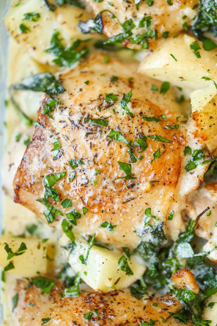 Chicken and Potatoes with Garlic Parmesan Cream Sauce - Crisp-tender chicken baked to absolute perfection with potatoes and spinach. A complete meal in one!