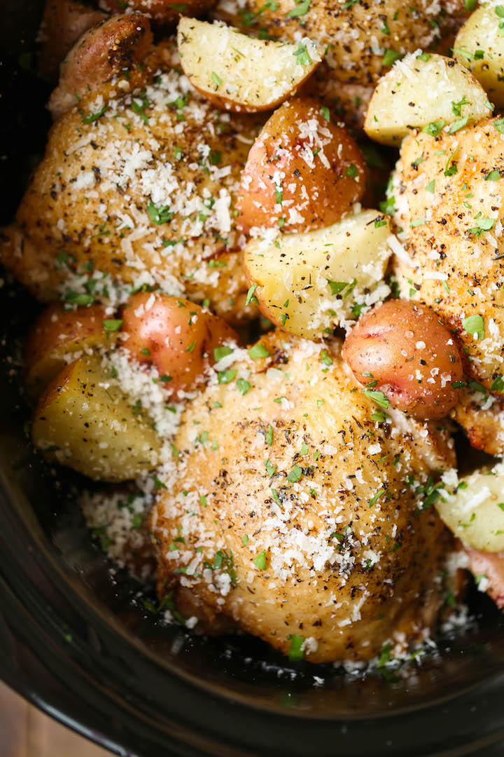 Slow Cooker Garlic Parmesan Chicken and Potatoes - Crisp-tender chicken cooked low and slow with baby red potatoes for a full meal! So easy and effortless!