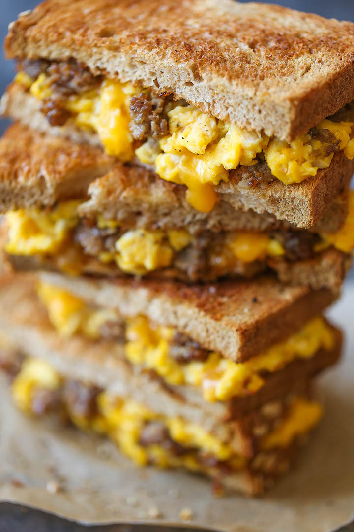Breakfast Grilled Cheese - The PERFECT excuse to have grilled cheese for breakfast - with scrambled eggs, sausage and of course, ooey gooey melted cheese!