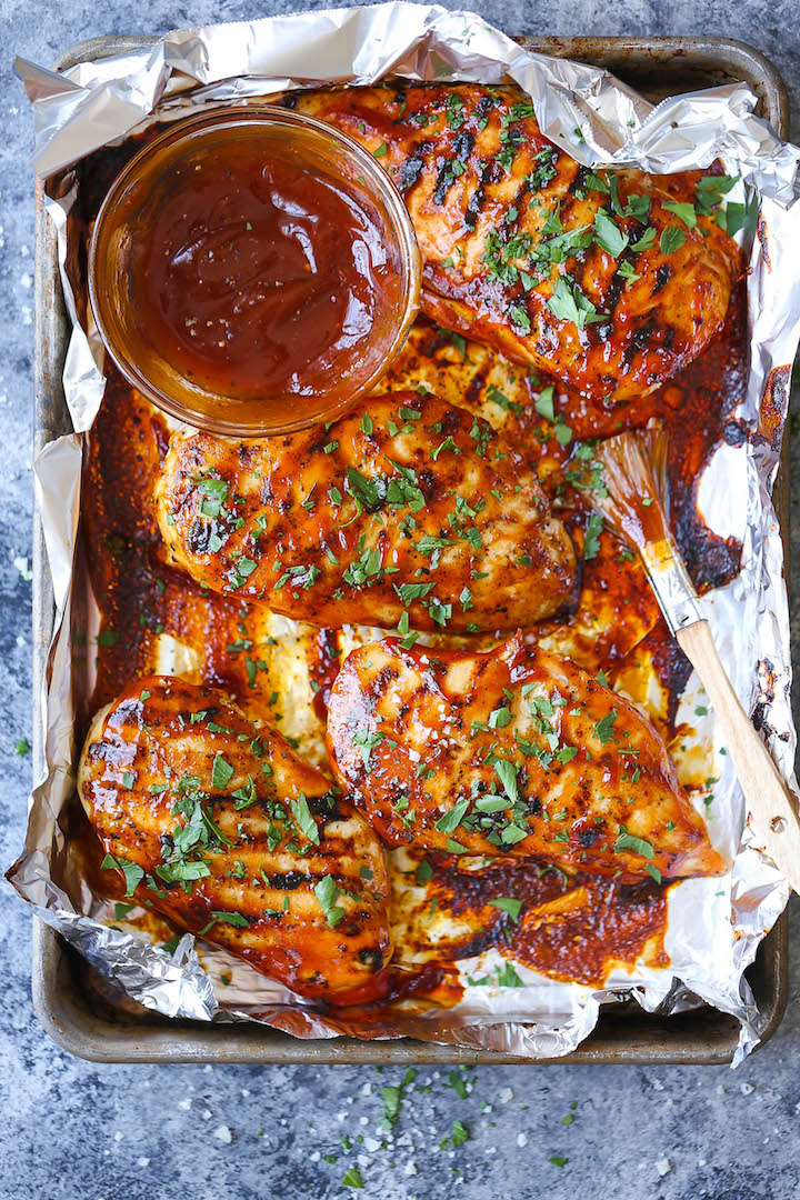 BBQ Chicken Breasts - The most tender, juicy chicken grilled to PERFECTION, smothered in a thick, homemade BBQ sauce. You can also make this ahead of time!
