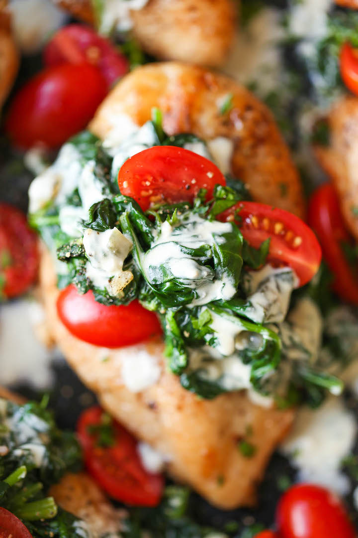 Chicken Florentine with White Wine Cream Sauce - Juicy chicken breasts topped with fresh spinach, tomatoes and a creamy white sauce that is AH-MAZING!