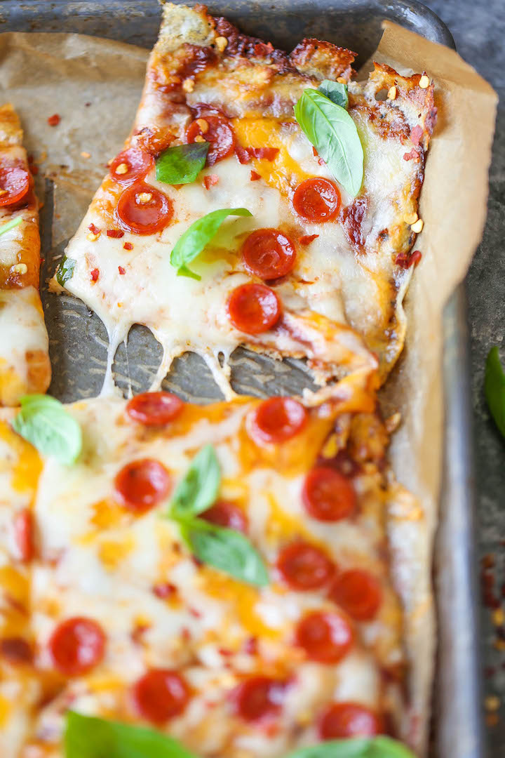 The Best Cauliflower Pizza Crust - Easy to make, grain-free AND so healthy. Plus, you will honestly not even be able to taste a difference!
